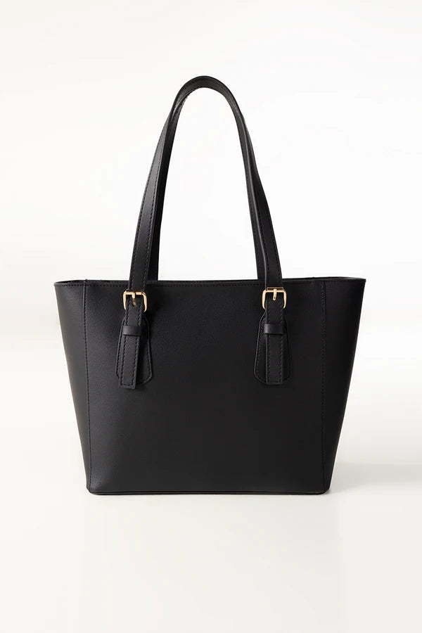 Black handbag with gold hardware on a white background