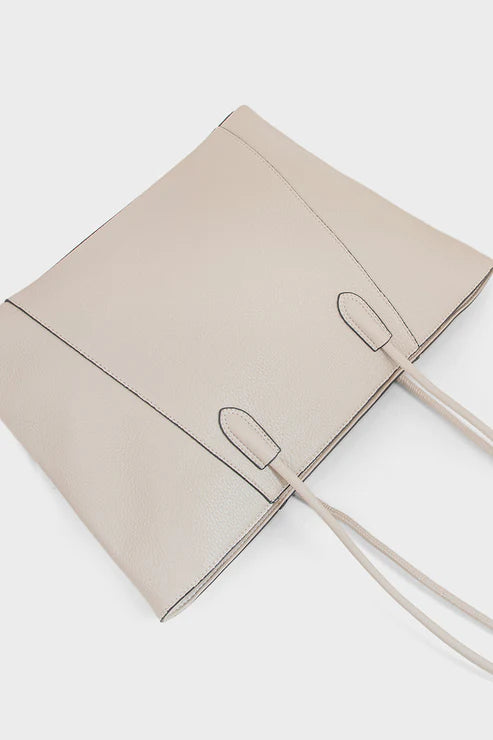 Beige handbag with a strap on a white background