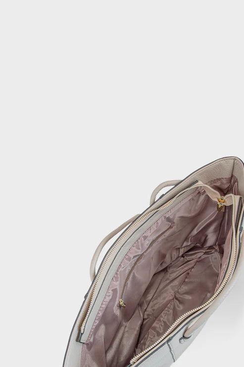 Open handbag with visible interior on a light gray background