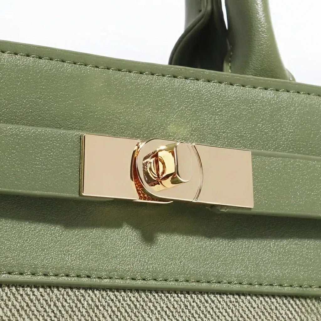 Green handbag with a gold clasp on a white background
