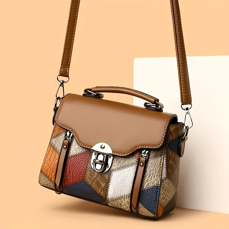 Multicolored patchwork handbag with a brown strap on a beige background