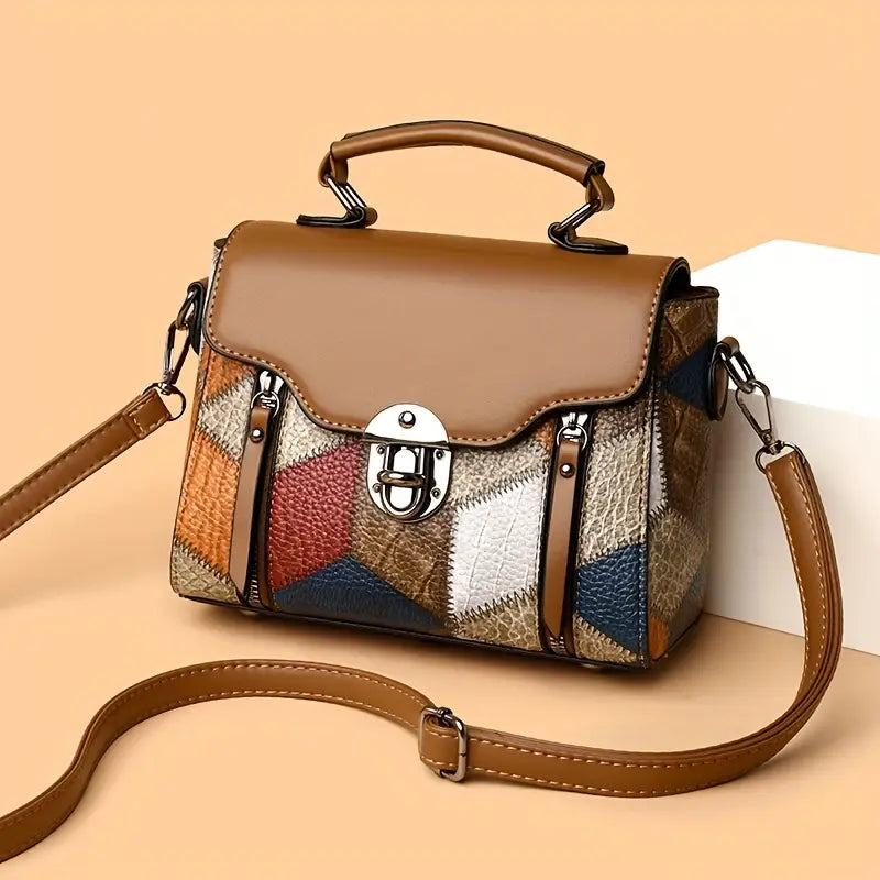 Multicolored patchwork handbag with a brown strap on a beige background