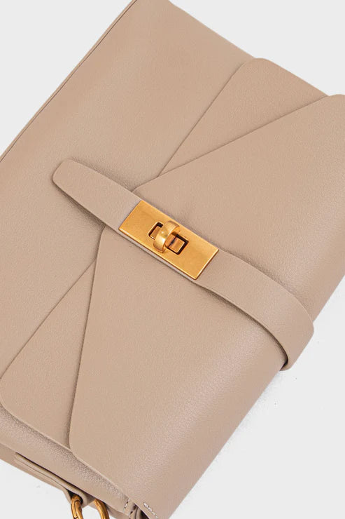 Beige handbag with a gold clasp on a white background