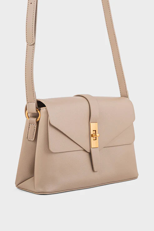 Beige handbag with a gold clasp on a white background
