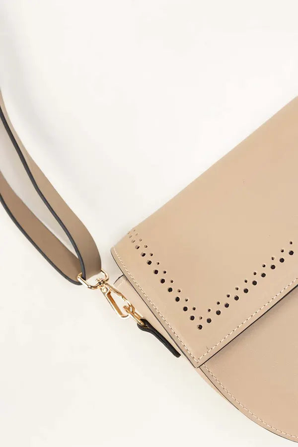 Beige handbag with perforated design on a white background