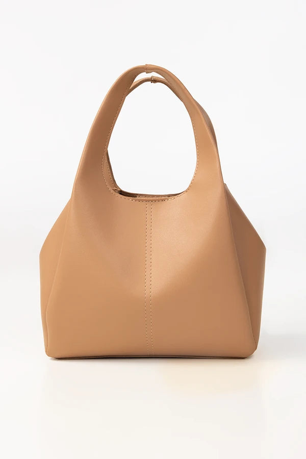 Tan handbag on a white background