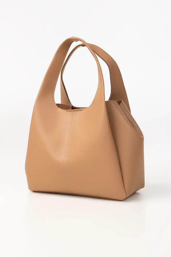 Tan handbag on a white background