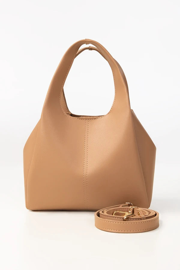 Tan handbag with matching strap on a white background