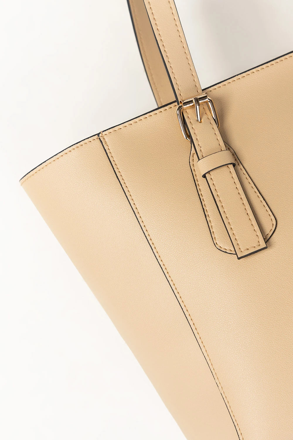 Beige handbag with a strap on a white background