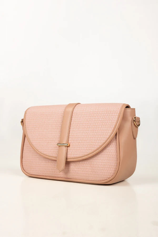 Pink textured handbag on a white background