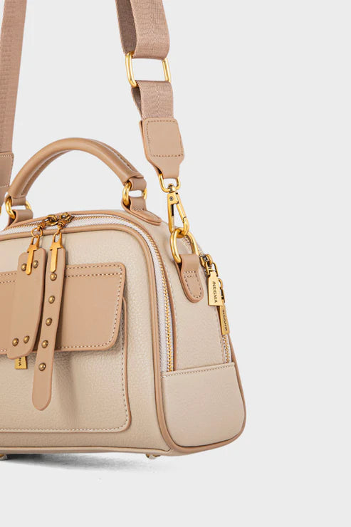 Beige handbag with gold accents on a light gray background
