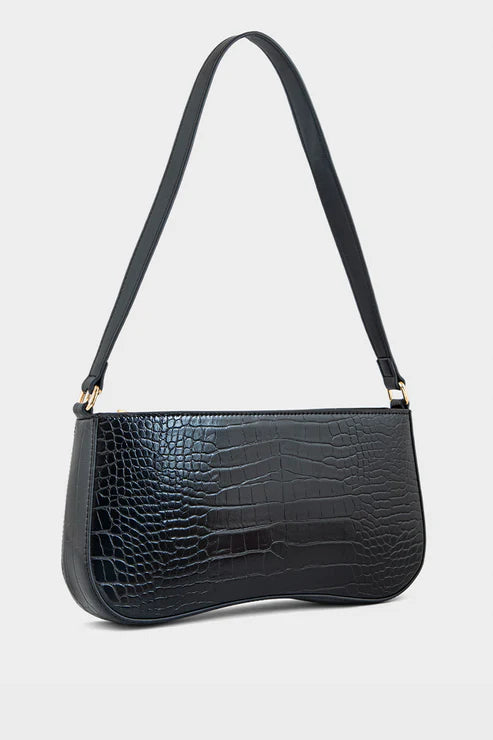 Black crocodile-patterned handbag with a strap on a light gray background