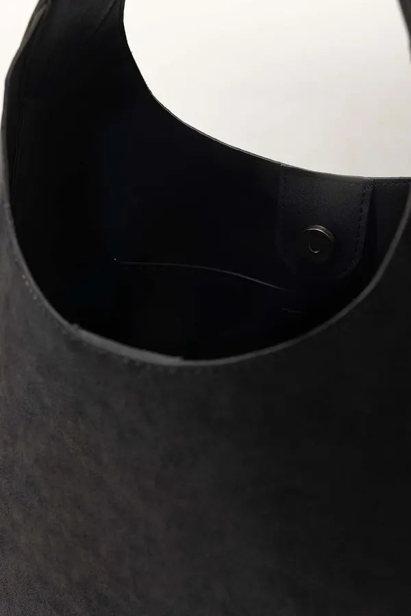 Close-up of a black helmet with a white visor