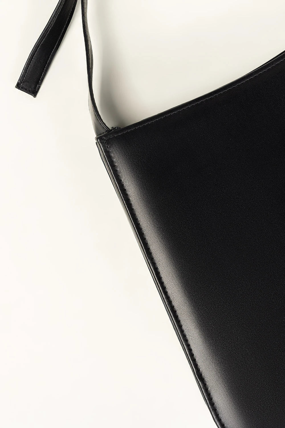 Black leather strap on a white background
