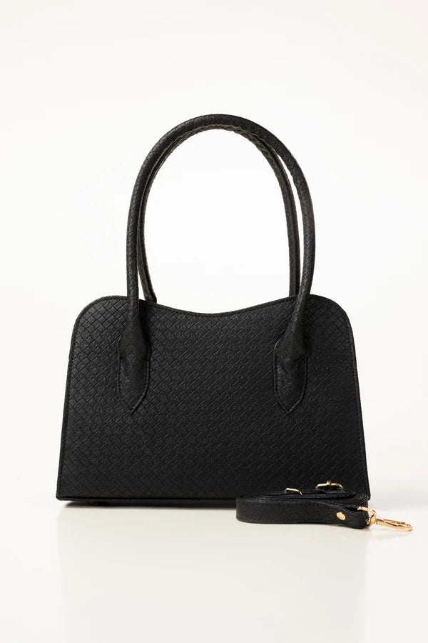 Black handbag with a strap on a white background