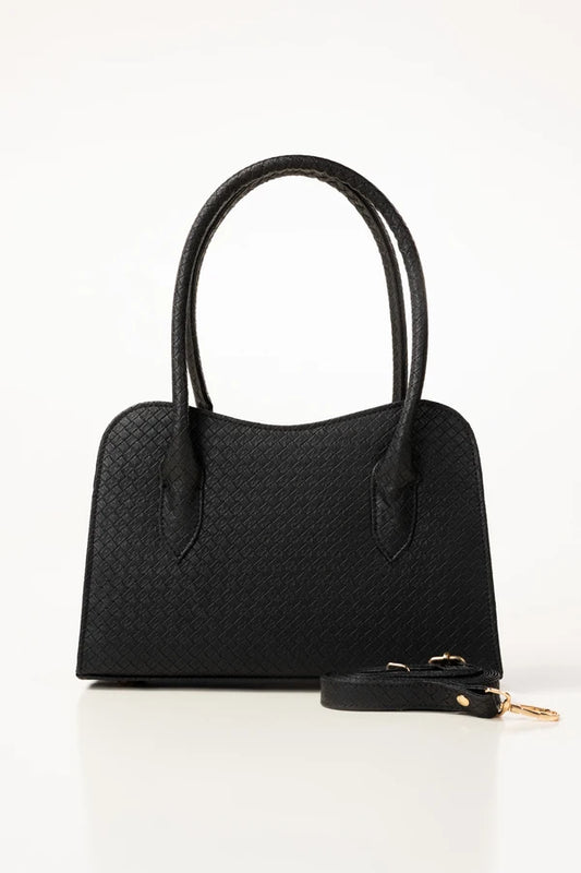 Black handbag with a strap on a white background