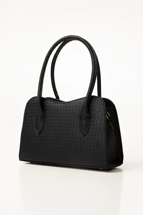 Black handbag with a textured pattern on a white background