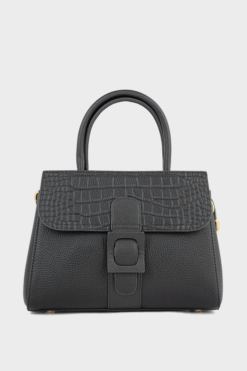 Black textured handbag with a buckle on a light gray background