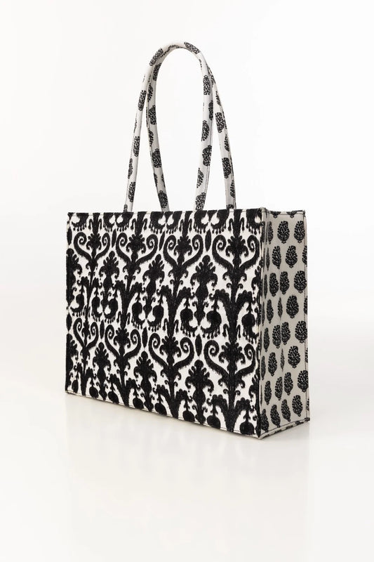 Black and white patterned tote bag on a white background