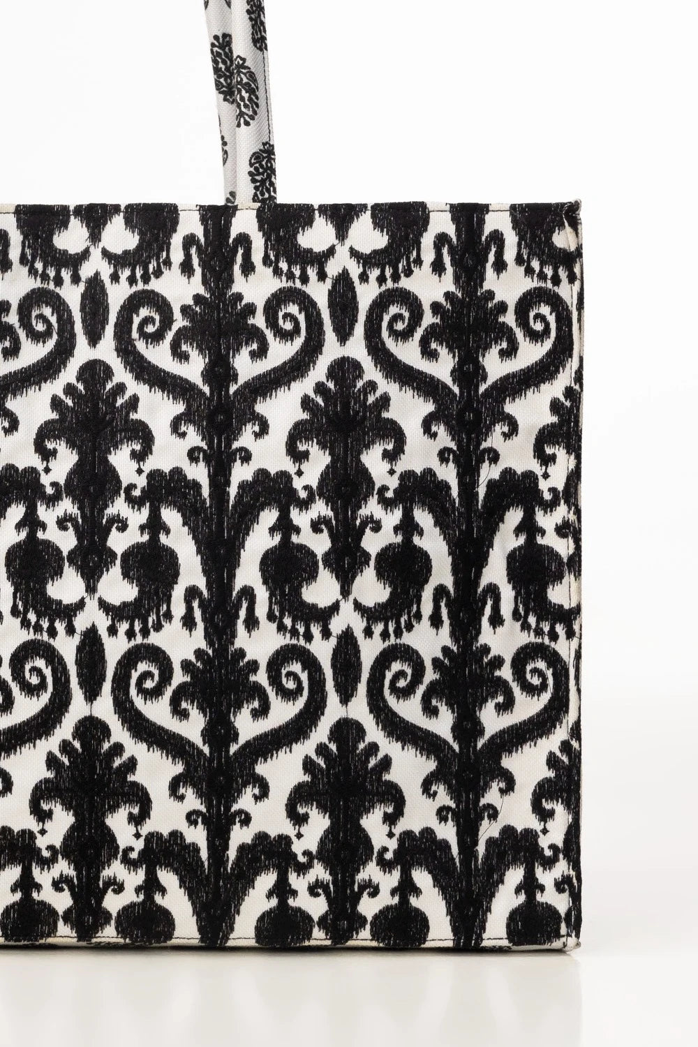 Black and white patterned tote bag on a white background