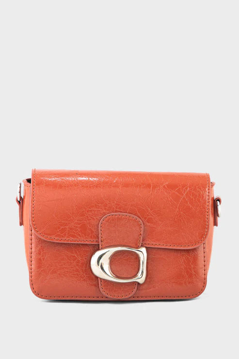 Orange handbag with a silver buckle on a white background