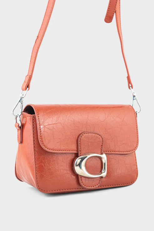 Brown crossbody bag with a gold clasp on a light gray background