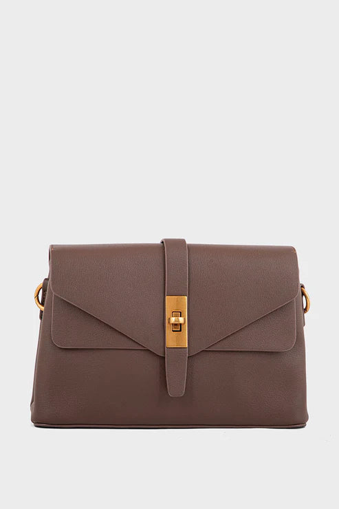 Brown handbag with gold accents on a light gray background