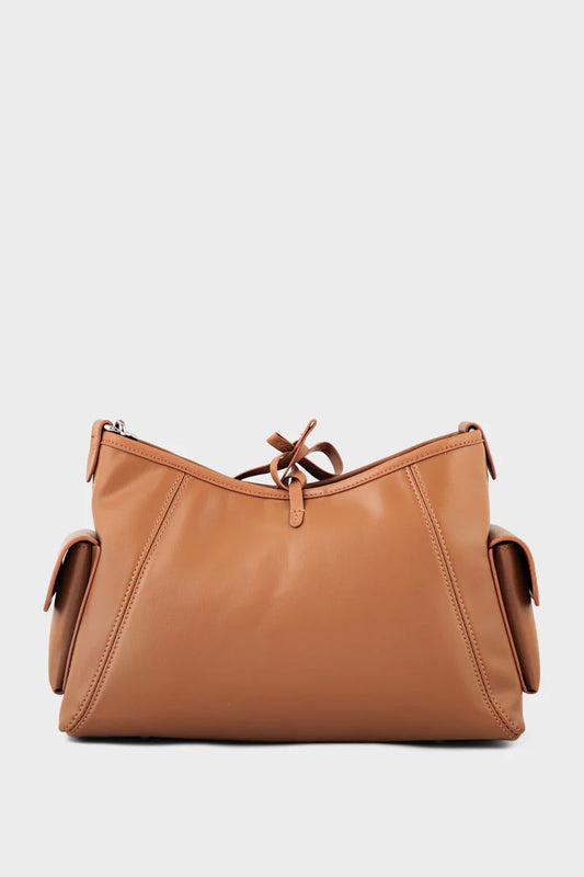 Brown leather handbag on a light gray background
