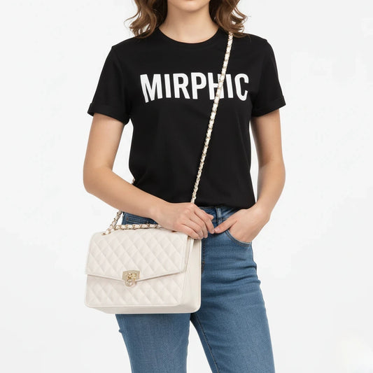 Person wearing a black t-shirt with 'MIRPHIC' text, holding a white quilted handbag on a plain background