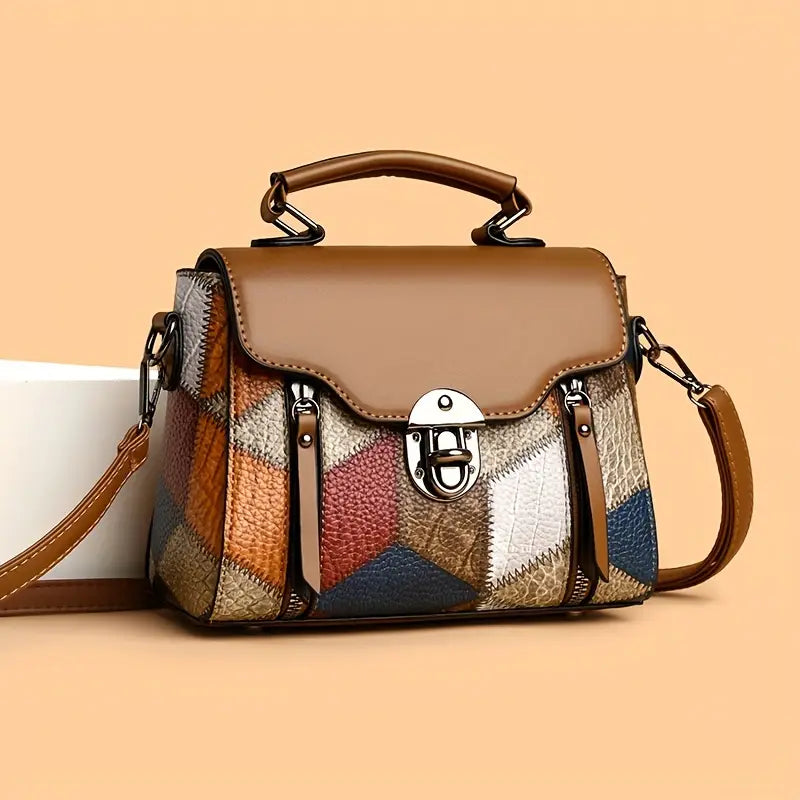 Multicolored patchwork handbag with a brown handle on an orange background