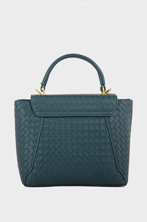 Green textured handbag on a light gray background