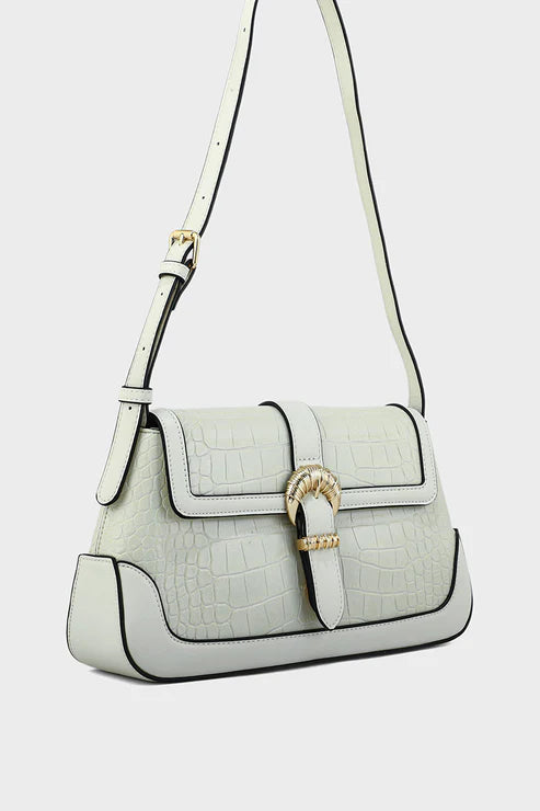 White handbag with gold buckle on a light gray background
