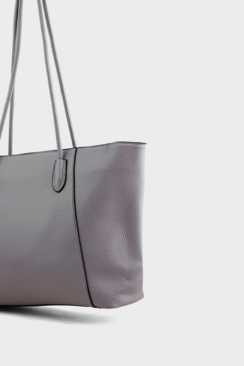 Gray tote bag with a strap on a light gray background
