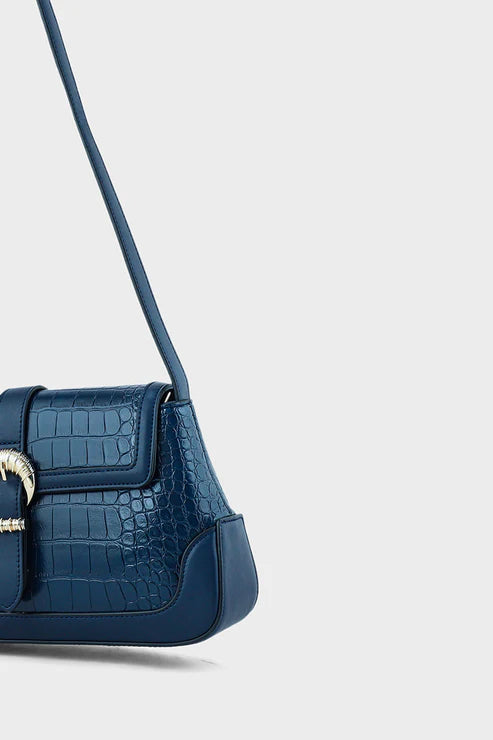 Blue handbag with a gold clasp on a light gray background