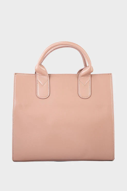 Pink tote bag on a light pink background