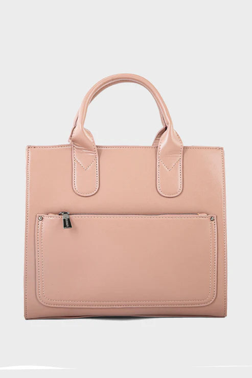 Pink handbag with a front pocket on a white background