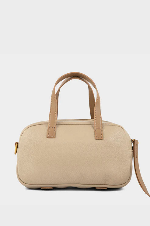 Beige handbag with brown handles on a light gray background