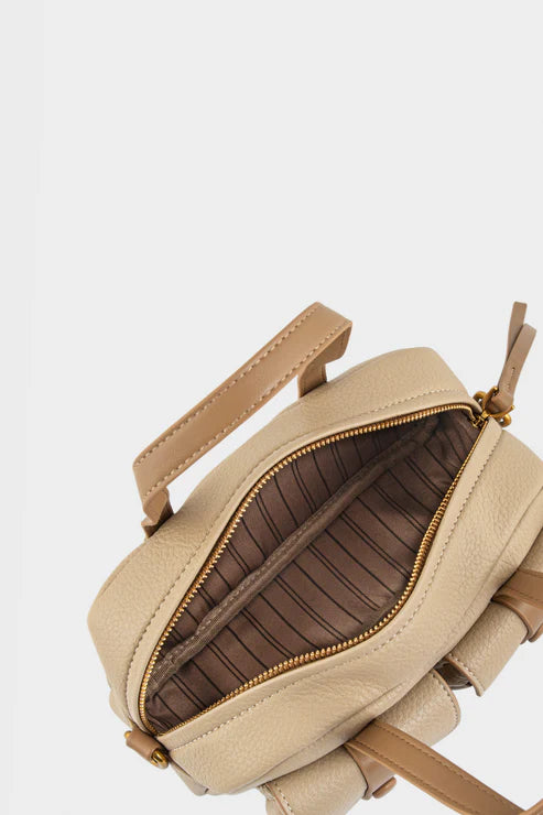 Beige backpack with open zipper on a light gray background