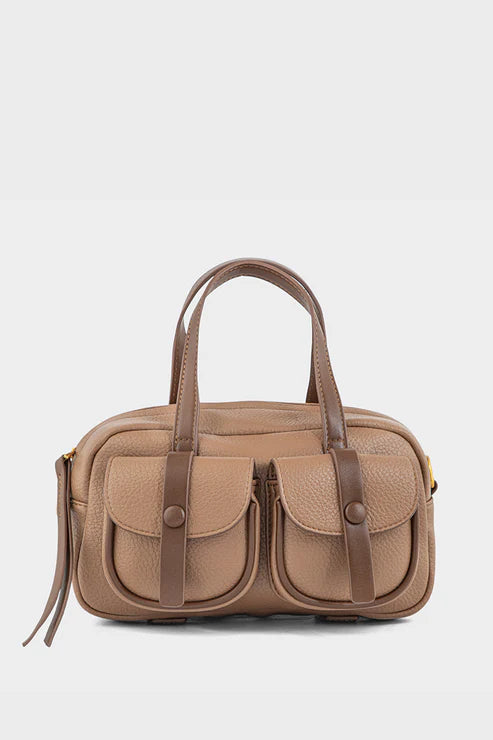 Brown handbag with leather straps on a white background