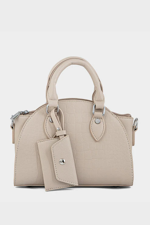 Beige handbag with matching pouch on a light gray background