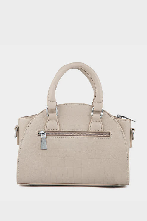Beige handbag with quilted design on a light gray background