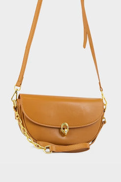 Tan handbag with a gold chain detail on a light gray background