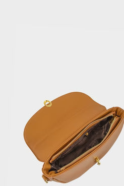Tan handbag with gold zipper on a light gray background
