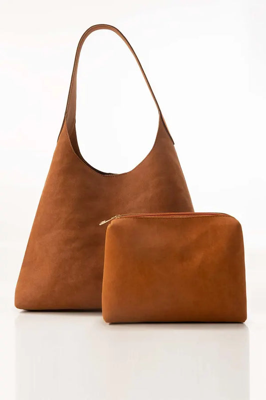 Brown leather handbag and matching pouch on a white background