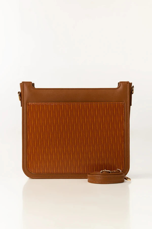 Brown leather crossbody bag on a white background