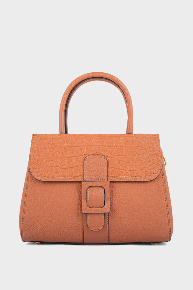 Brown handbag with a buckle on a light gray background