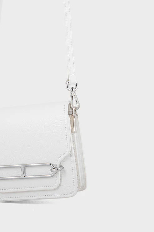 White handbag with a silver clasp on a white background